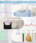 10 Pack Travel Hangers for Cruises and Trips holding various garments in a wardrobe, showcasing space-saving foldable design.