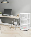 Three Tier Rolling Storage Cart With Removable Wheels in white frame next to a desk setup in a home office