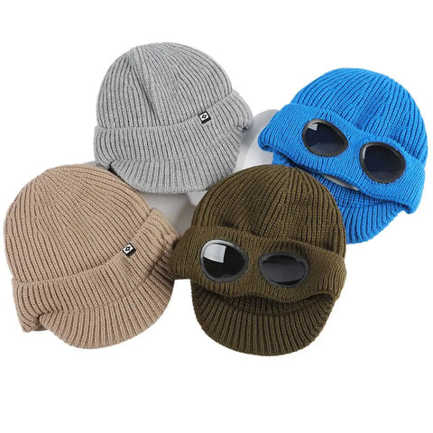 Four colorful Unisex Peak Ski Beanies With Thick Fleece Lining, Cozy Knit Hat For Winter, in gray, blue, brown, and olive, laid out flat.