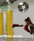 Heavy Duty Four Wheel Hoist Trolley Assembly installed in gym with boxing bag, showcasing use in warehouse and industrial settings.