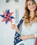 Woman holding All American 12 Pack Patriotic Pinwheels For Yard And Garden Fourth Of July Outdoor Decorations American Flag Wind Spinner