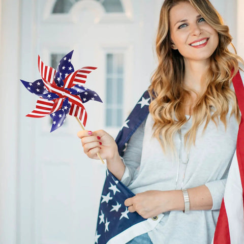 Woman holding All American 12 Pack Patriotic Pinwheels For Yard And Garden Fourth Of July Outdoor Decorations American Flag Wind Spinner
