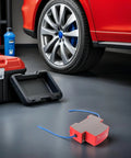 Straight Up Automatic Vehicle Fire Extinguisher For Trucks And Sedan Rides Thirty Gram Ultra Aerosol Suppression System on garage floor.