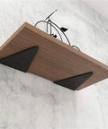 Heavy Duty Triangle Shelf Brackets For Wall Mount Floating Corner Supports with wooden shelf and black metal brackets.