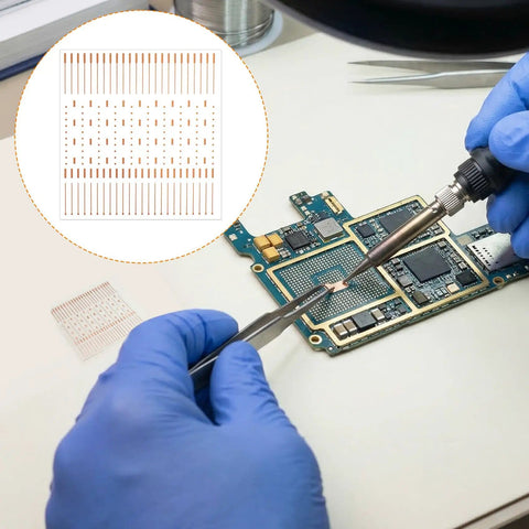 Hands using soldering iron with PCB Trace Repair Kit With 208 Red Copper Solder Pads For Mobile Phone Circuits on motherboard
