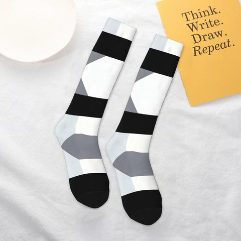 Black And White Piano Grid Thigh High Socks Unisex Breathable Moisture Wicking Crew Socks For Women Men laid flat, showcasing design and comfort.