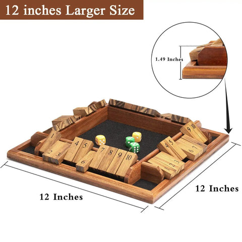 12 inch Shut The Box Dice Game on a solid wood tabletop, showing black felt surface and multi-colored dice, for 1 to 4 players