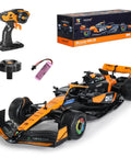 McLaren F1 Licensed 1/14 Remote Control Car in orange with 2.4GHz RC racer controller, battery, and packaging.