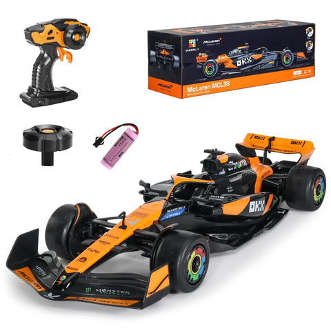 McLaren F1 Licensed 1/14 Remote Control Car in orange with 2.4GHz RC racer controller, battery, and packaging.