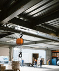 Four Wheel Hoist Trolley For Unistrut 1-5/8 Inch Or Taller Channel With M10 Bolt And Lifting Eye Nuts installed in warehouse