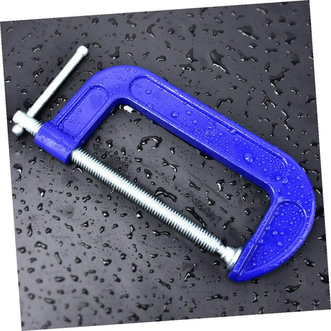 Blue Beefy Heavy Duty 6-Inch G Clamps For Woodworking And Metalworking on wet black surface