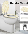 Elongated Vintage luxury seamless floral golden monstera leaves Toilet Seat shown on a white toilet with resin material and stainless steel hinges.