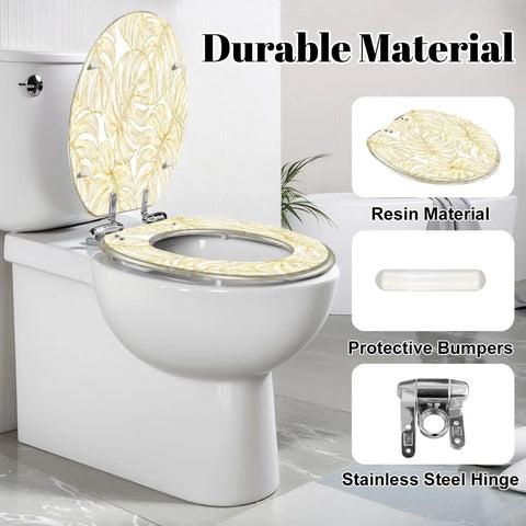 Elongated Vintage luxury seamless floral golden monstera leaves Toilet Seat shown on a white toilet with resin material and stainless steel hinges.