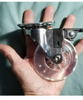 4 Pack 3 Inch Swivel Caster Wheels For Furniture 800Lbs Lockable Heavy Duty in hand, showing size and clear polyurethane