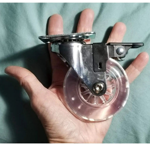 4 Pack 3 Inch Swivel Caster Wheels For Furniture 800Lbs Lockable Heavy Duty in hand, showing size and clear polyurethane
