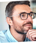 I don't know who this person is, but they are wearing eyeglasses with a contemplative expression.