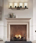 Farmhouse 4 Light Vanity Fixtures With Seeded Glass Shades above a fireplace, vintage rustic lighting for cozy cottage vibe