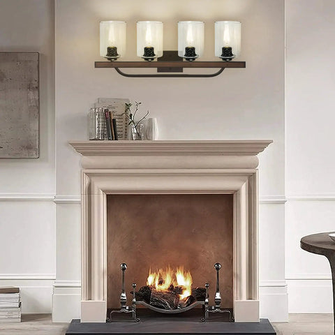 Farmhouse 4 Light Vanity Fixtures With Seeded Glass Shades above a fireplace, vintage rustic lighting for cozy cottage vibe