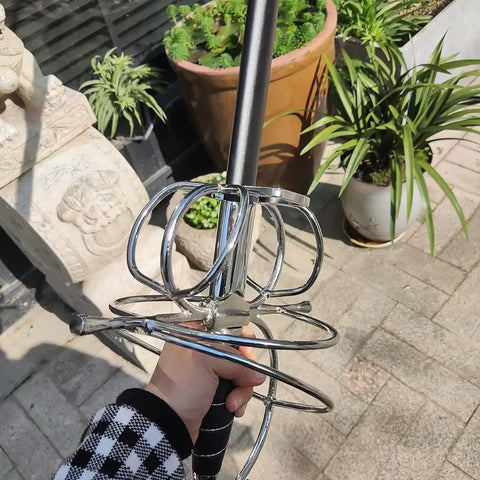 Close-up of Renaissance Spiral Swept-Hilt Rapier Sword For Cosplay And Collection, Italian style guard held outdoors