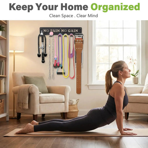 Woman practicing yoga near 8 Hook Wall Mount Home Gym Organizer Rack For Barbells Resistance Bands Jump Ropes Foam Rollers Belts