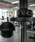 Close-up of carbon steel wrist strength trainer for 2-inch Olympic plates in gym setting, focus on clamp detail