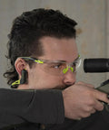 Man aiming with rifle wearing Wave Banded Ear Plugs With Flexible Neckband For Easy Access Gray Yellow Noise Reduction To 22dB Solid