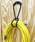 Heavy Duty Nylon Cord Strap Organizer Rope For Tailgate Parties And Campouts Holds Generator Cords Tight on a yellow cord.