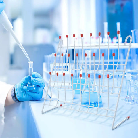 Chill Out Your Lab Setup With This Sleek White Metal Test Tube Drying Rack, 30x30cm, holding glassware in a lab environment.