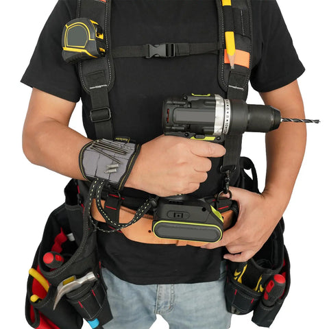 Person wearing a tool belt suspenders with magnetic wristband for framer carpenter electrician worksite ready all day comfort 4 point support padded backing breathable straps adjustable fit gray holding a drill
