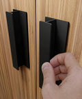 Self Adhesive Edge Finger Pull Door Handle 2 Pack Peel And Stick No Drill Installation on wood cabinet with hand using handle