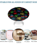 Video Game Weapon Themed Badass Cabinet Knobs And Drawer Pulls Set with colored gaming controllers on black background