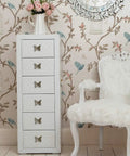 White dresser with Pack Of 5 Vintage Butterfly Cabinet Door Knobs in antique bronze finish, floral wallpaper background
