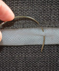 Using Extra Strong Upholstery Repair Thread Kit Pro Grade With Heavy Duty Curved Needles on dark fabric