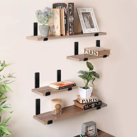 Matte Black J Lip Wall Shelf Brackets Hella Sturdy 8 Pack holding rustic floating shelves with books and plants on wall.