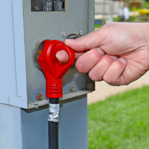 Hand plugging RV Power Cord 30 Amp 25 Foot with 90 Degree Detachable Plug Red into an outdoor power outlet