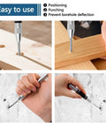 Knockout 5 Inch Automatic Center Punch Marker Spring Loaded Self Centering Hole Starter for Metal Wood and Plastic, in use on wood and wall.