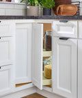 Two-Tier Pie-Cut Lazy Susan Organizer For Base Corner Kitchen Cabinets With Almond Plastic Shelves 28 Inch Wide 18 Inch Deep 26 Inch High Easy Inside-Cabinet Assembly Space Saving Design Smooth 360 Degree Access visible in open cabinet showing shelves with jars.
