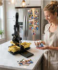 Fridge Magnet Maker Kit With 2 By 2 Inch Square Diy Photo Magnet Press Includes Paper Cutter 100 Sets Acrylic Supplies And 100 Sheets Photo Paper For Easy Custom Refrigerator Magnets on kitchen counter with woman holding photo.