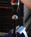 External Rotary Deburring And Chamfer Tool Pro Grade For 13 To 36 Millimeter Range attached to a drill in use on a metal rod