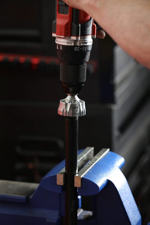 External Rotary Deburring And Chamfer Tool Pro Grade For 13 To 36 Millimeter Range attached to a drill in use on a metal rod