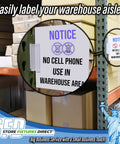 Heavy Duty Warehouse Aisle Sign Holders With Flexible Hinge For Pallet Rack Uprights holding a safety notice in a busy warehouse.