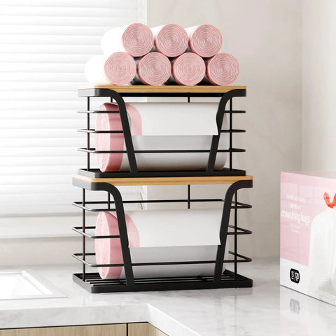 Two Pack Stackable Trash Bag Holder And Dispenser With Bamboo Top For Laundry And Kitchen Storage No Drill Wall Mount Organizer Great For Small Spaces And Busy Kitchens Keeps Bag Rolls Ready, shown stacked with pink bag rolls on a countertop.