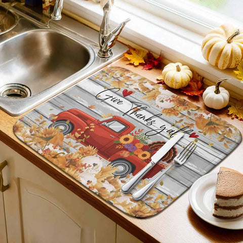 Set Of 2 Absorbent Microfiber Dish Drying Mats For Kitchen Counter 16 X 18 Inches Machine Washable Fall Autumn Thanksgiving Sunflower Red Truck Wood Grain Design Cozy Holiday Decor And Durable Non Slip Pad on kitchen counter with sunflower and red truck design.
