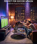 Clip On 8 Inch Portable Fan with 20000mAh battery on coffee table cooling room during soccer game