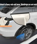 Beefy Magnetic EV Charger Port Cover For Hyundai Ioniq 5 And Ioniq 6, beige weatherproof shield applied on snowy vehicle.