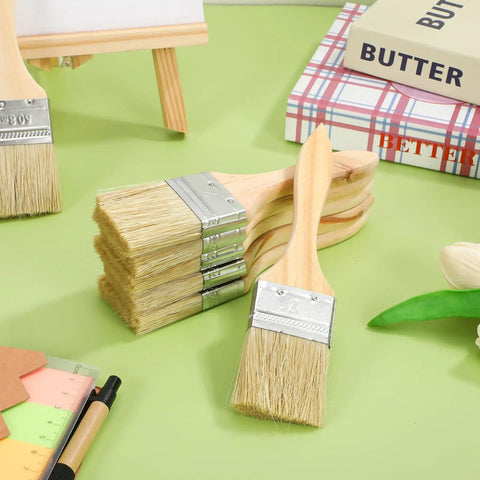 Stack of 30 Piece Thick Wood Handle Paint Brush Set, 2 Inch Flat Stain And Cabinet Brushes arranged on a green surface.