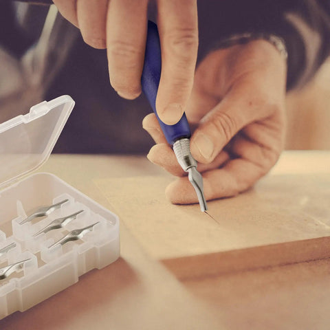 Close-up of blue-handled tool from 12 Pack Linoleum Cutter Kit For Block Printing And Linocut in use with blade set beside