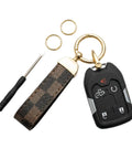 Top Shelf Leather Keychain With Secure Anti Lost D Ring And Heavy Duty Zinc Alloy Clip For Car And Home Keys. Smooth brown checkered leather.