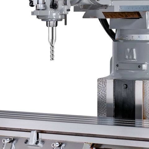 CNC milling machine spindle holding a 1/8-inch end mill over a metal worktable