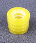 Stack of Dope 12 Pack 11mm X 30m BOPP packing tape for packaging and school use, easy to cut and refill, strong adhesive